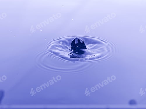 Preview: Close Up Water Droplet Affect The Surface, Forming Rings On The Surface And Making A Perfect