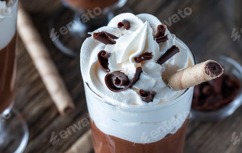 Preview: A Close Up View Of The Top Portion Of A Chocolate Mousse Parfait Topped With Whipping Cream And