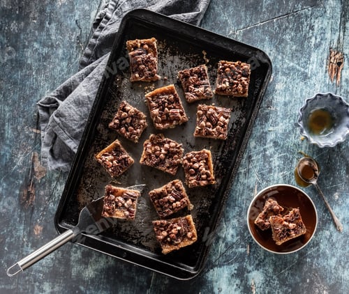 Preview: Sheet Pan Filled With Caramel Pecan Chocolate Chip Squares Ready For Eating.