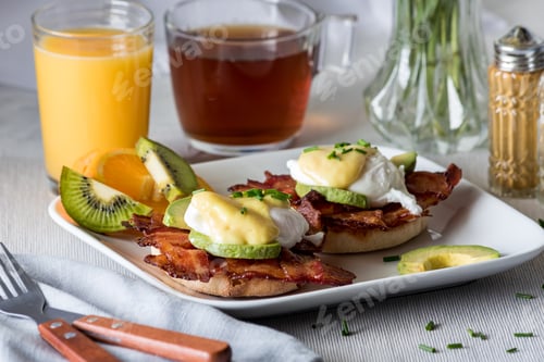 Preview: A Close Up View Of A Plate Of Eggs Benedict Ready For Breakfast.