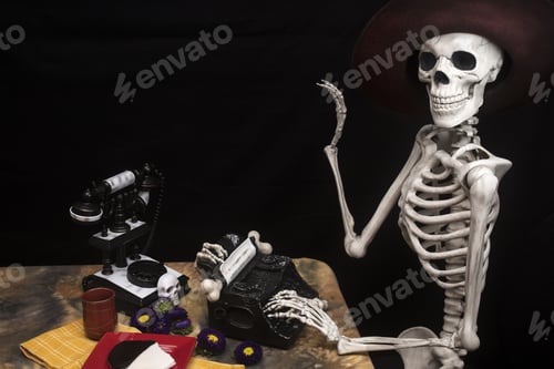 Preview: Human Halloween Skeleton With A Typewriter, Telephone And Cookie On A Plate