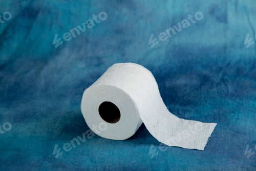 Preview: Rolls Of Soft Toilet Paper On A Textured Aqua Marine Blue Cloth Background