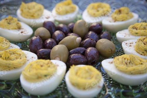Preview: Marinated Kalamata Olives And Green Olives Stuffed With Garlic Served With Deviled Eggs Sprinkled