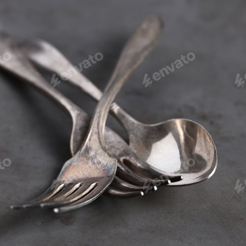 Preview: Closeup Still Life Of Antique Forks And Spoon On Gray Metal Background,. Shallow Depth Of Field