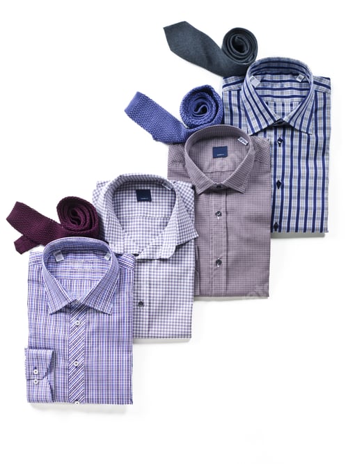 Preview: Folded Shirts with Ties on a White Background
