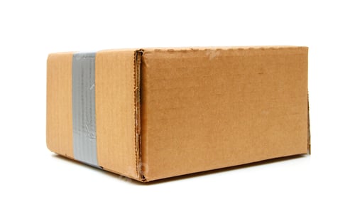 Preview: Closed Cardboard Box Taped Up And Isolated On A White Background.