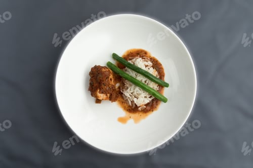 Preview: A Dinner Of Chicken With Salsa Or Chicken Cacciatore In An Elegant White Bowl On A Blue Table