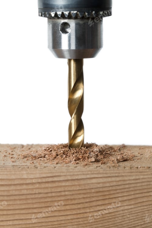 Preview: Close Up Image Of Drilling A Piece Of Wood Plank Against White Background