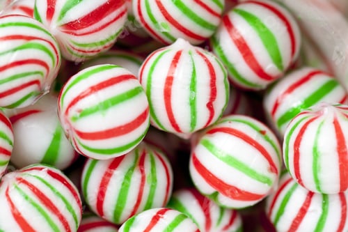 Preview: View Of A Heap Of Colorful Candies With Red And Green Stripes.