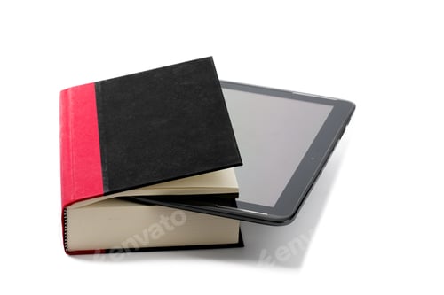 Preview: An Computer Tablet With An E-Book Reader App Stuck Into A Hard Cover Book Isolated On White