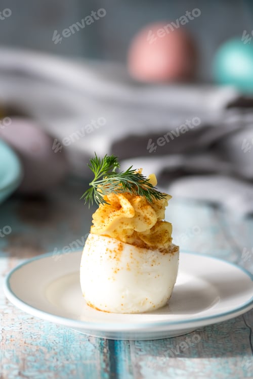 Preview: A Close Up View Of A Deviled Egg Ready For Eating.