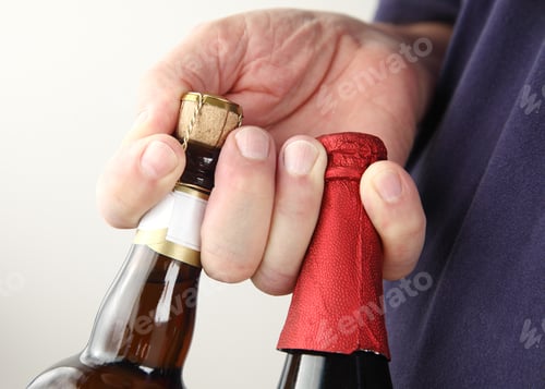 Preview: Two Large Beer Bottles In Man'S Fingers