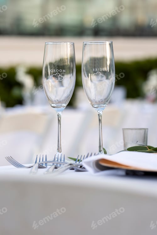 Preview: Crystal Glasses For A Bride And Groom On A Table Set For A Wedding Ceremony