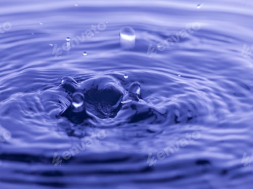Preview: Water Drop Falling Into Blue Water Abstract Background