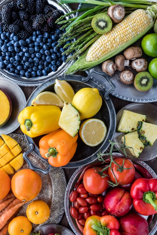 Preview: Various Fruits And Vegetables Arranged In Rainbow Colours On Metal Plates.