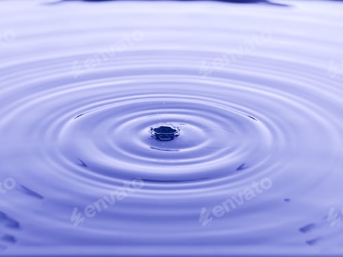 Preview: Close Up Water Droplet Affect The Surface, Forming Rings On The Surface And Making A Perfect