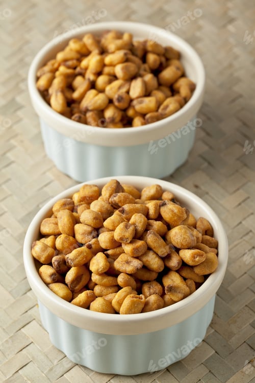 Preview: Vertical Image Of Two White Bowls With Dried Corn Beans Over The Mat