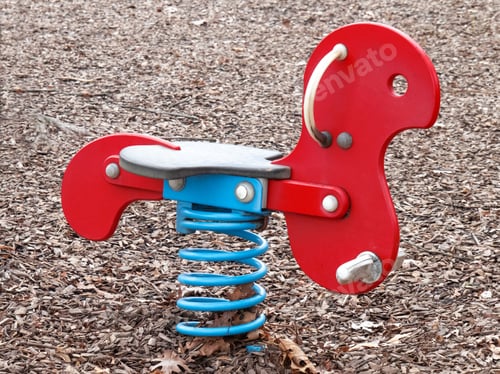 Preview: A Colorful Child'S Spring Rocking Horse In A Playground