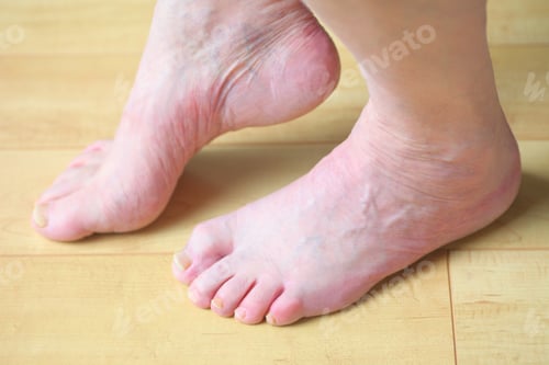 Preview: A Man Slightly Raises One Bare Foot On The Floor