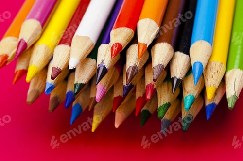 Preview: Close Up Of Bundled Crayons Isolated On Red.