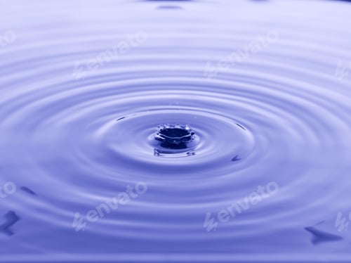 Preview: Close Up Water Droplet Affect The Surface, Forming Rings On The Surface And Making A Perfect