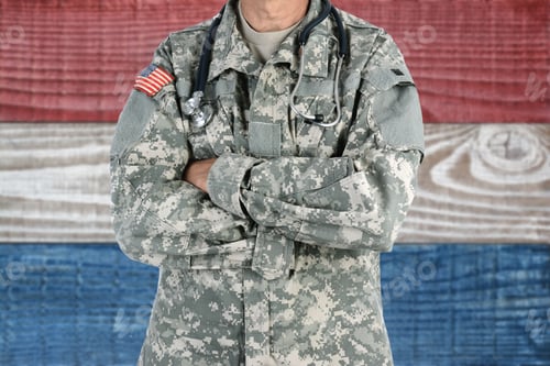 Preview: Closeup Of An American Soldier Medic In Front Of A Red, White And Blue Boards Background. Patriotic