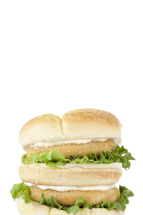 Preview: Close-Up Image Of Burger With Crispy Chicken And Vegetables Isolated On A White Background