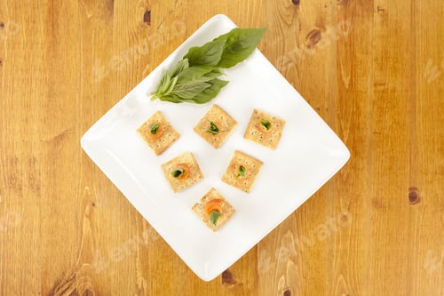 Preview: Close-Up Image Of A Plate Of Crackers With Smoked Salmon On The Wooden Table