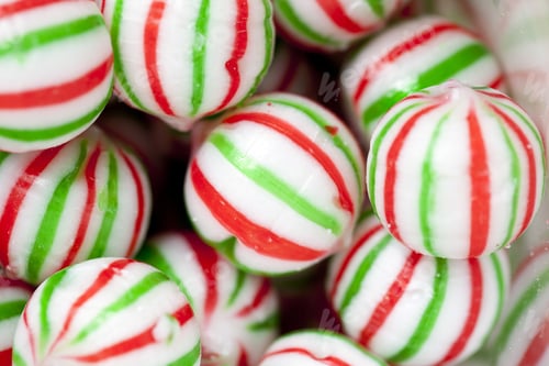 Preview: Detailed Shot Of A Large Group Of Colorful Christmas Candies With Red And Green Stripes.