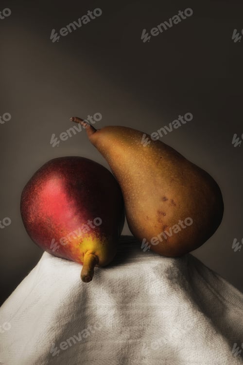Preview: Two Pears Leaning Together on White Cloth