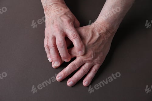 Preview: Overhead Of A Man With His Index Finger On An Aching Hand Joint