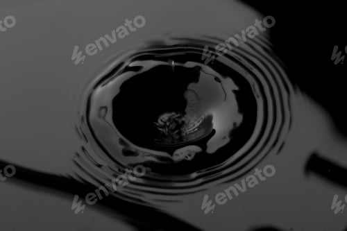 Preview: Close Up Water Droplet Affect The Surface, Forming Rings On The Surface And Making A Perfect