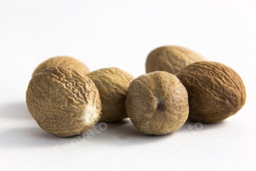 Preview: Close Up Nutmegs On A White Background
