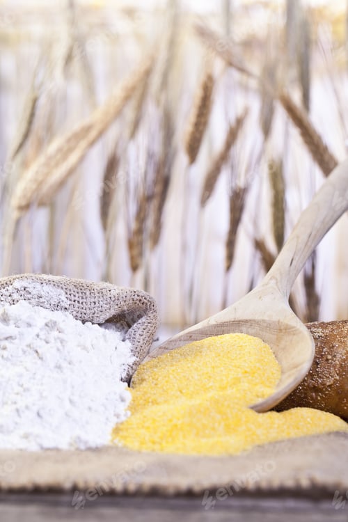 Preview: Close-Up Image Of Scoop Of Maize Flour And A Sack Of Wheat Flour