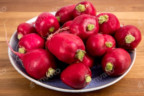 Preview: A Dish Of Large Red Radishes On A Wood Table Waiting To Be Sliced For A Salad