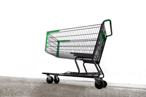 Preview: Looking Up At An Empty Shopping Cart Abandoned On A Parking Lot Isolated On White