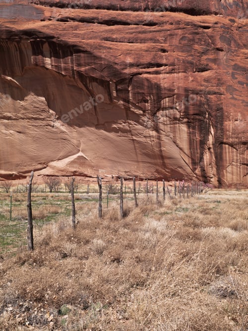 Preview: View Of Wooden Fence With Cliff In Background.