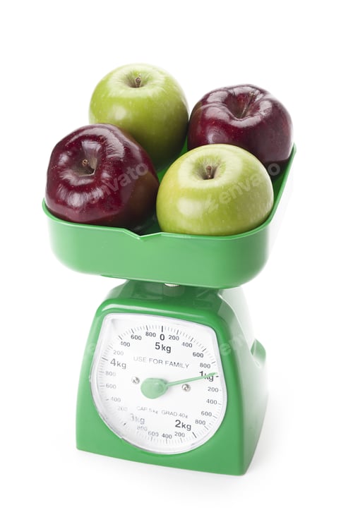 Preview: Apples On A Scale Weight Loss Concept Isolated On A White Background