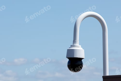 Preview: Security Camera On A White Pole On A Rooftop