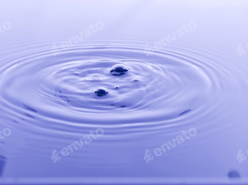 Preview: Close Up Water Droplet Affect The Surface, Forming Rings On The Surface And Making A Perfect