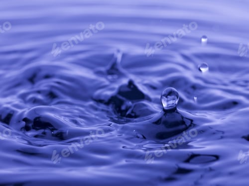 Preview: Water Drop Falling Into Blue Water Abstract Background