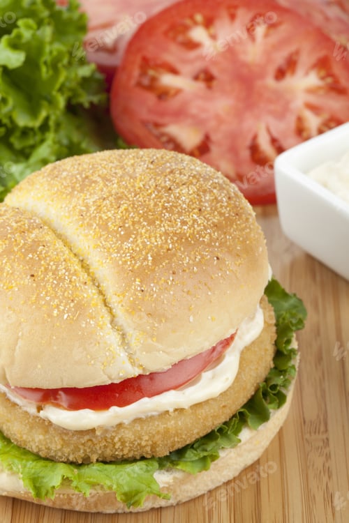 Preview: Close-Up Image Of Delicious Crispy Chicken Burger With Ingredients On The Background