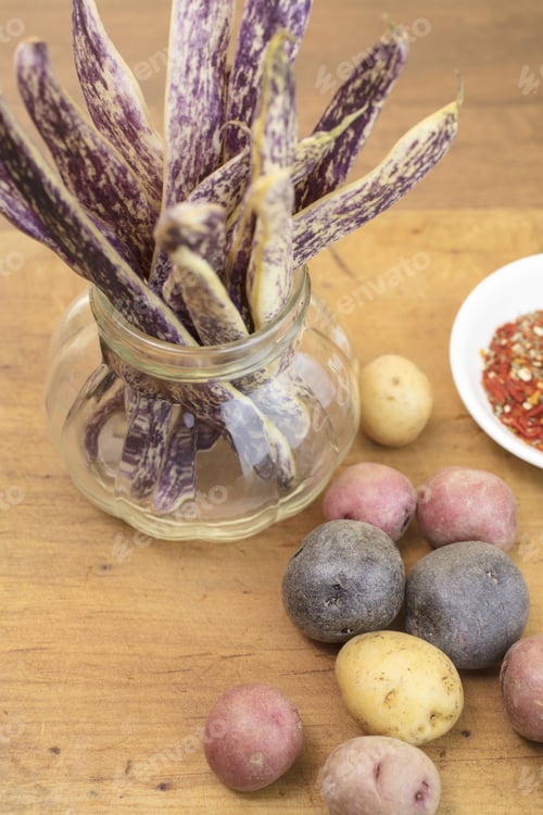 Preview: Dragon Tongue Beans Bunched In A Jar With Small Mini Potatoes And Spices On The Side