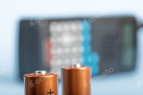 Preview: Closeup Of Double A Batteries With A Multi Band Police, Marine, Aviation Radio Receiver In The