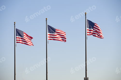 Preview: Image Of Three American Flag Against Blue Sky