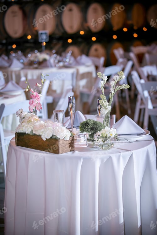 Preview: Elegantly Set Tables For An Evening Dinner Wedding Ceremony With Candles And Flowers As Center