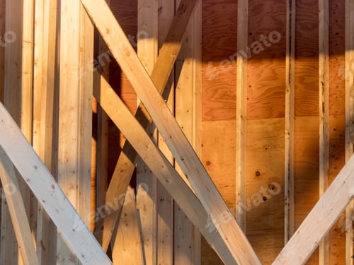 Preview: A Wall Of A House Under Construction Showing Studs And Plywood Sheathing And Bracing