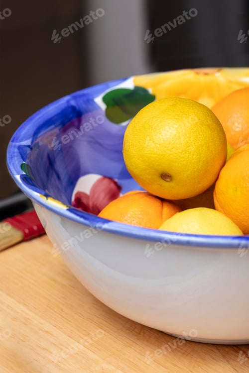 Preview: Large Bowl Of Colorful Oranges And Lemons On A Kitchen Counter Top