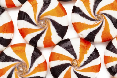 Preview: Extreme Close-Up Cropped Shot Of Identical Colorful Hard Candies With Swirl Pattern.
