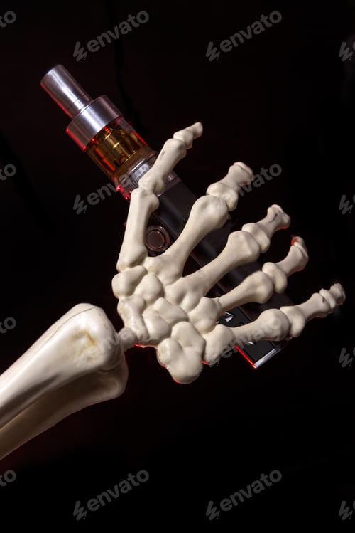 Preview: Skeleton Hand Holding An Ecigarette With Ejuice In It